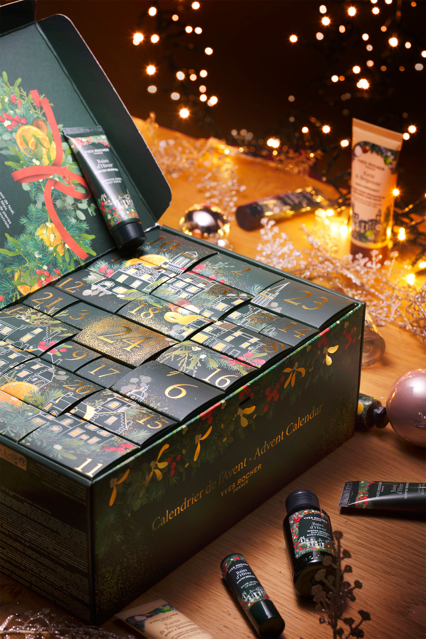 Top view of the fully opened Yves Rocher 2025 Advent Calendar displaying all numbered drawers and compartments, surrounded by selected beauty products and festive decor.