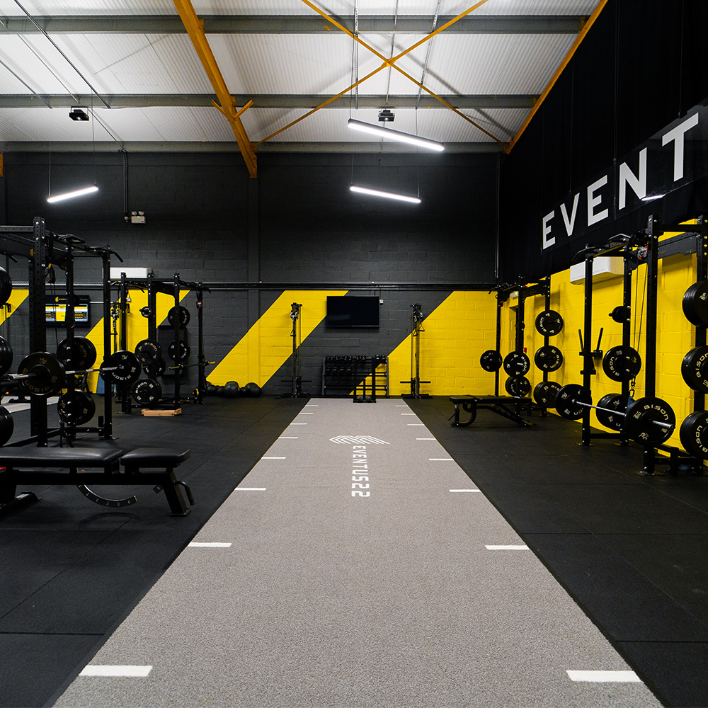 A directors lounge at Ipswich stadium with views to the pitch, showcasing interior design, furniture and bar