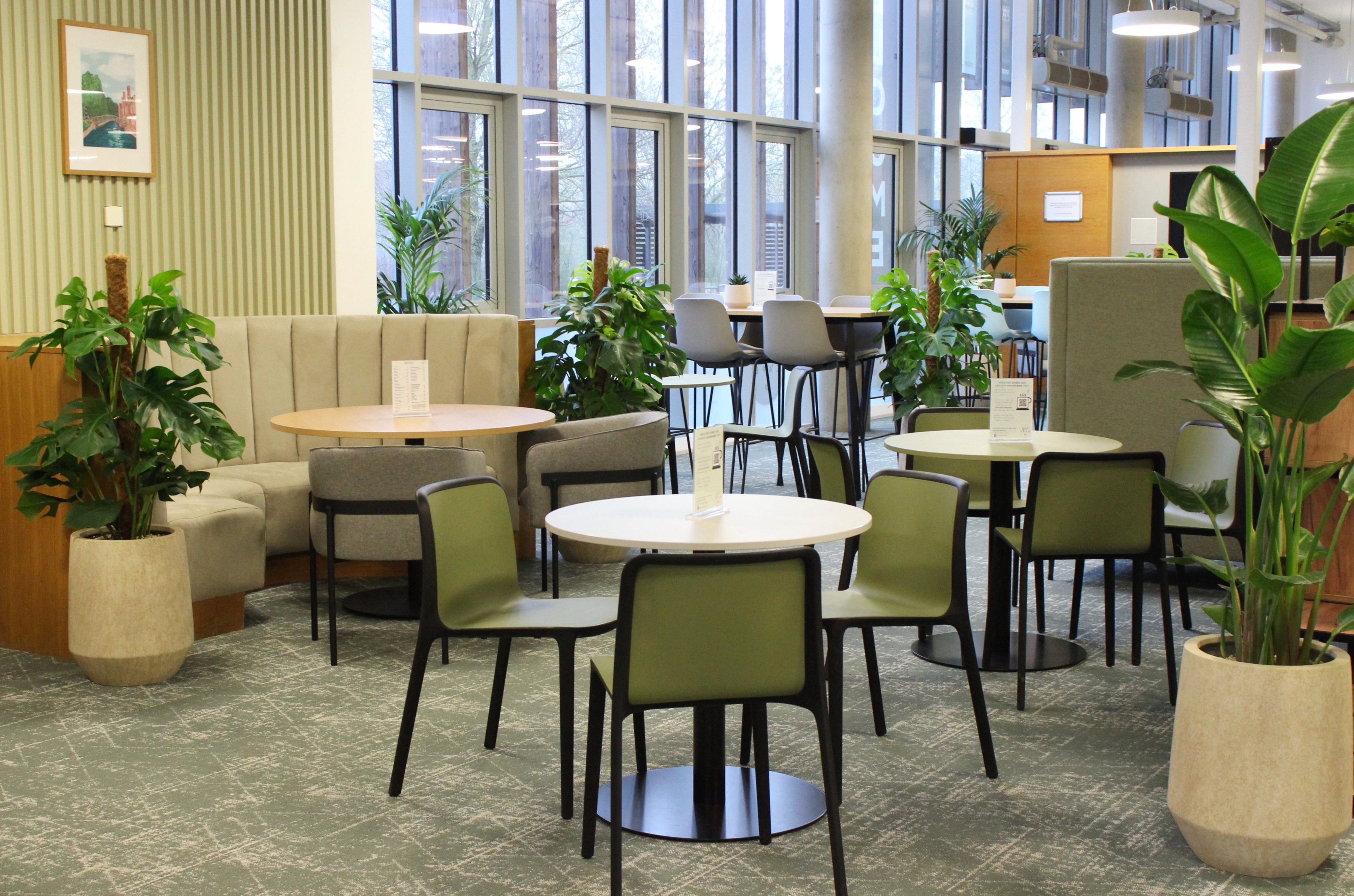 A directors lounge at Ipswich stadium with views to the pitch, showcasing interior design, furniture and bar