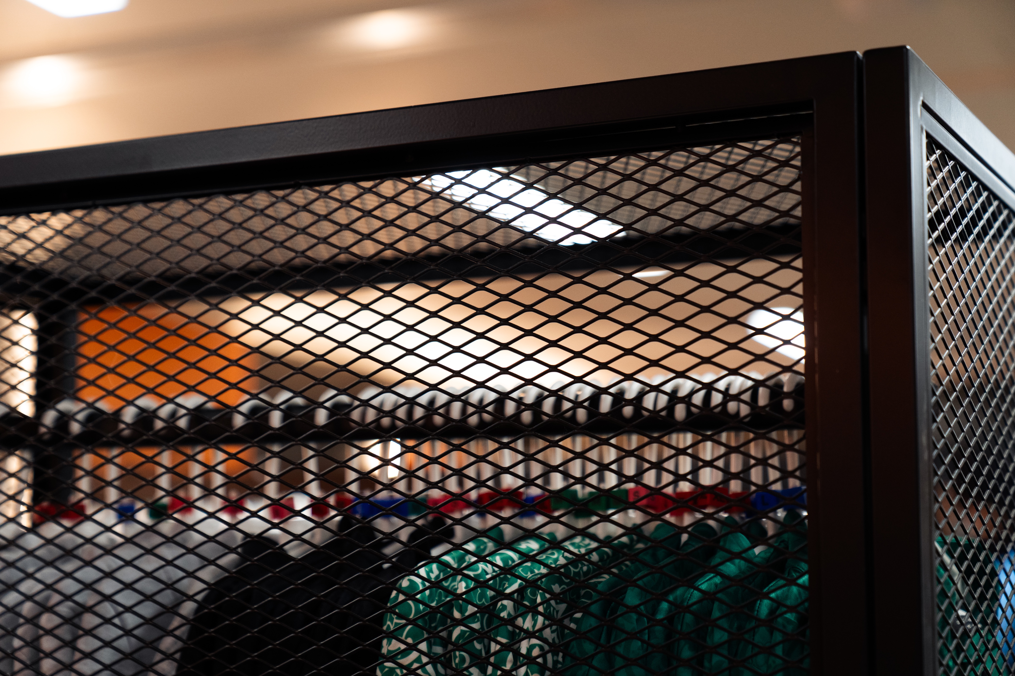 close up of black metal rail used for displaying clothing