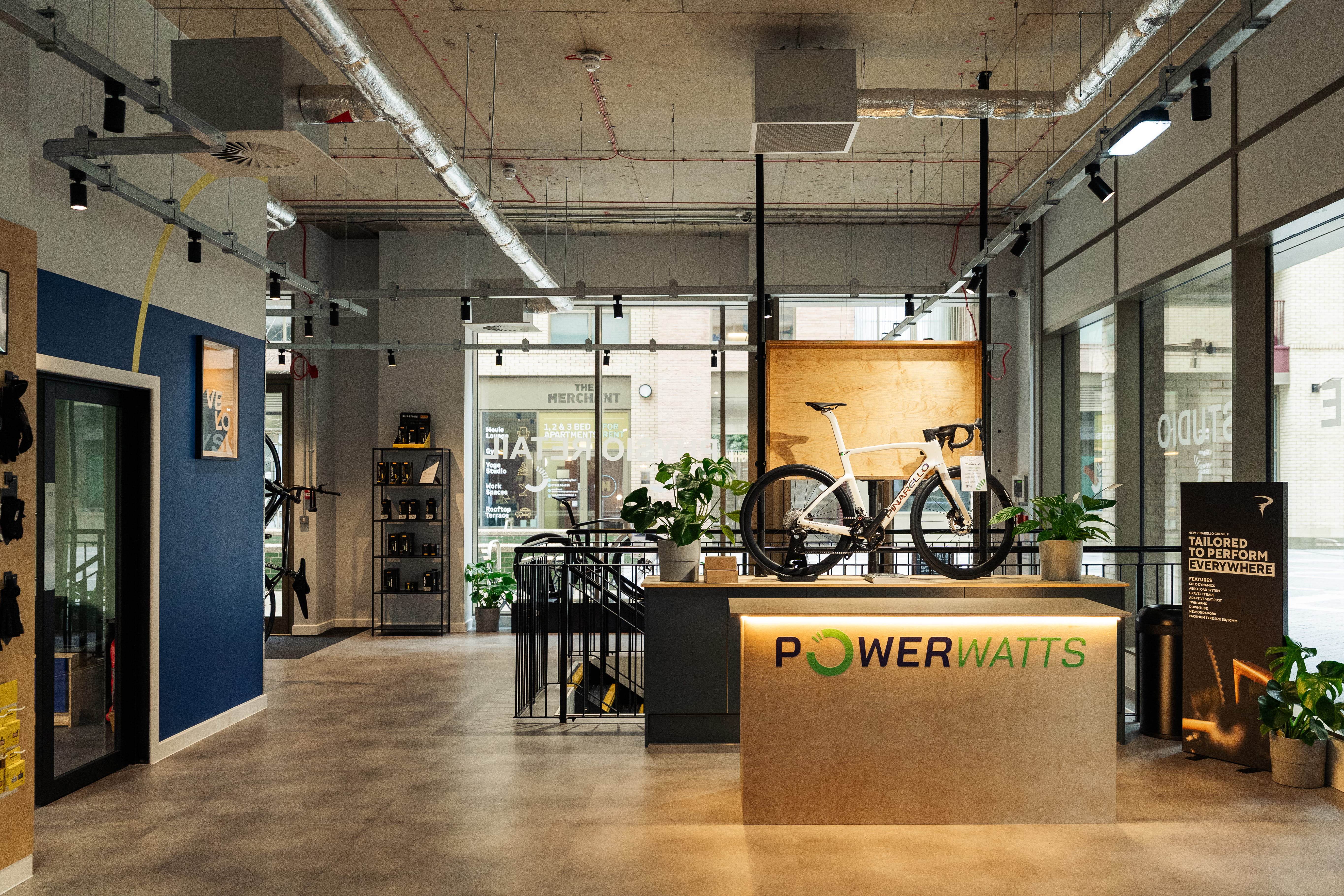 A directors lounge at Ipswich stadium with views to the pitch, showcasing interior design, furniture and bar