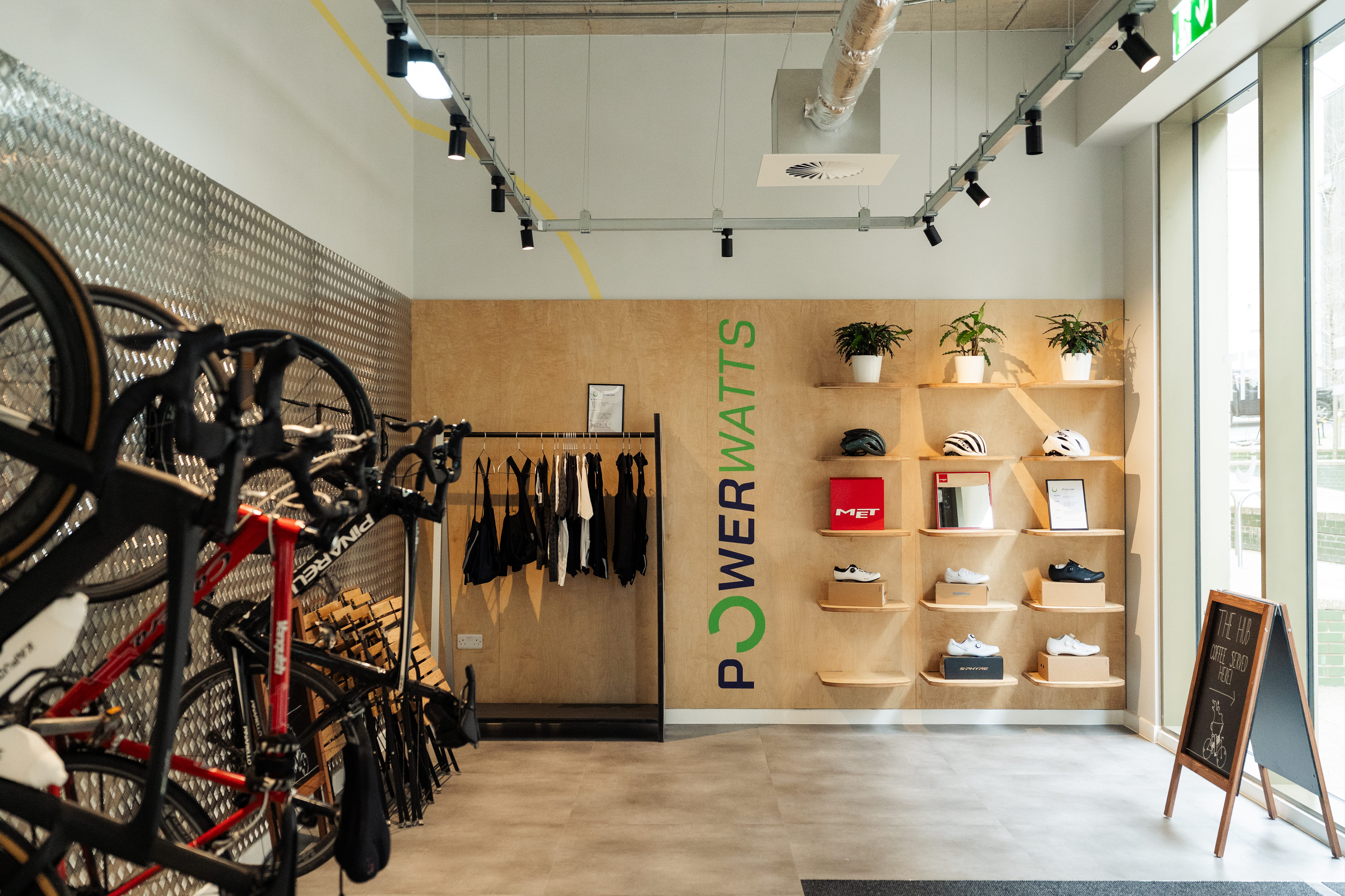 large retail space with wooden wall display for cycling equipment