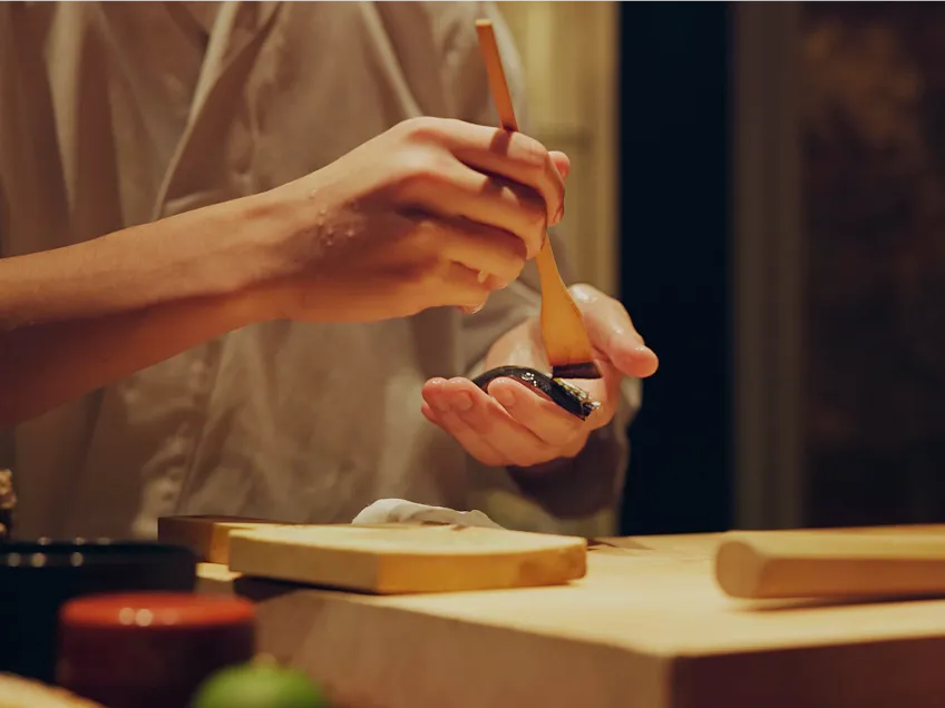 A photo of the setup for an outdoor movie screening and picnic hosted by The Little Nell in Aspen, Colorado.