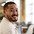 Asian man smiling at the camera