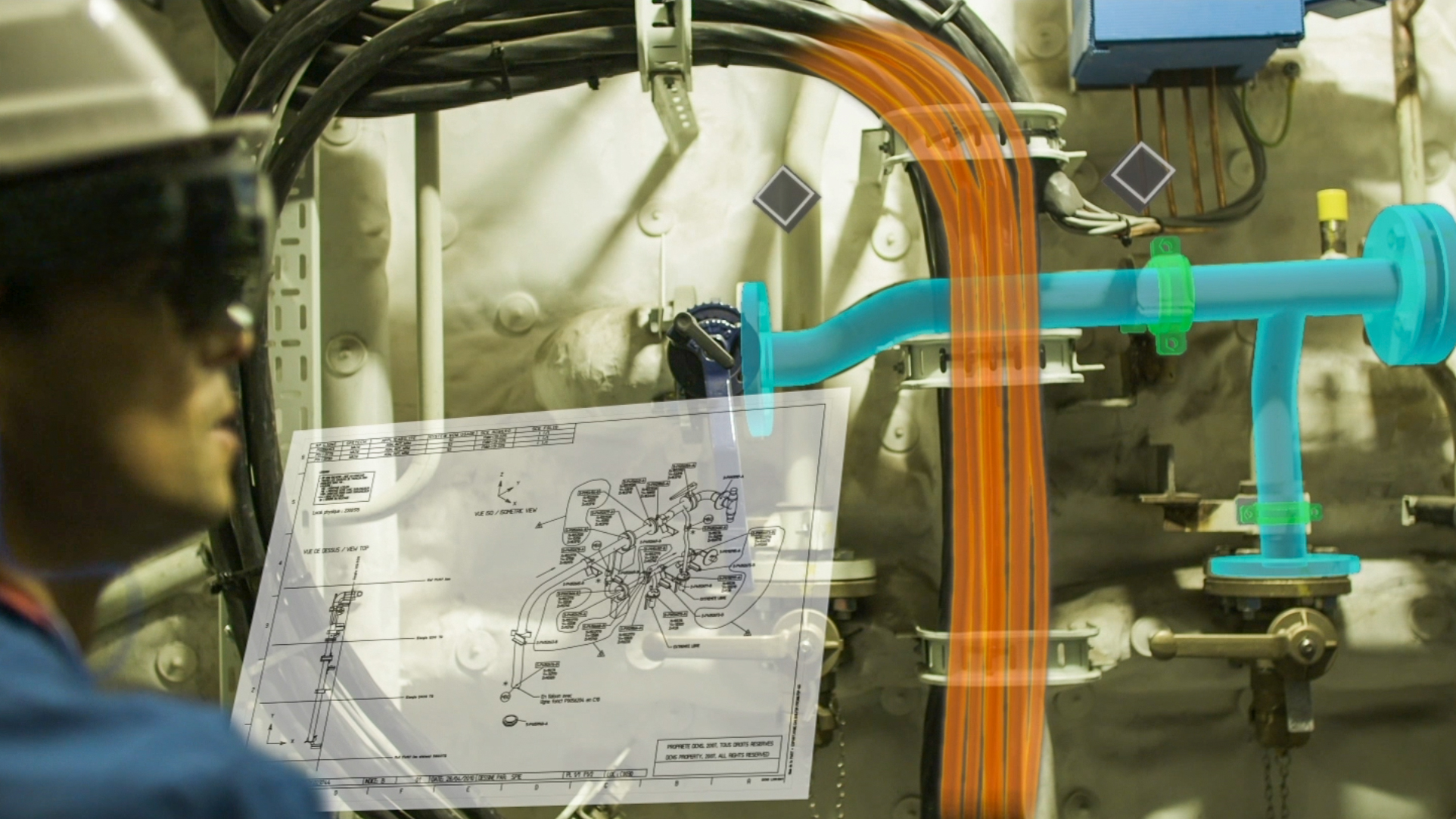 Technician equipped with augmented reality glasses visualizing a technical diagram and colored pipes superimposed on them to optimize the maintenance and identification of industrial installations.