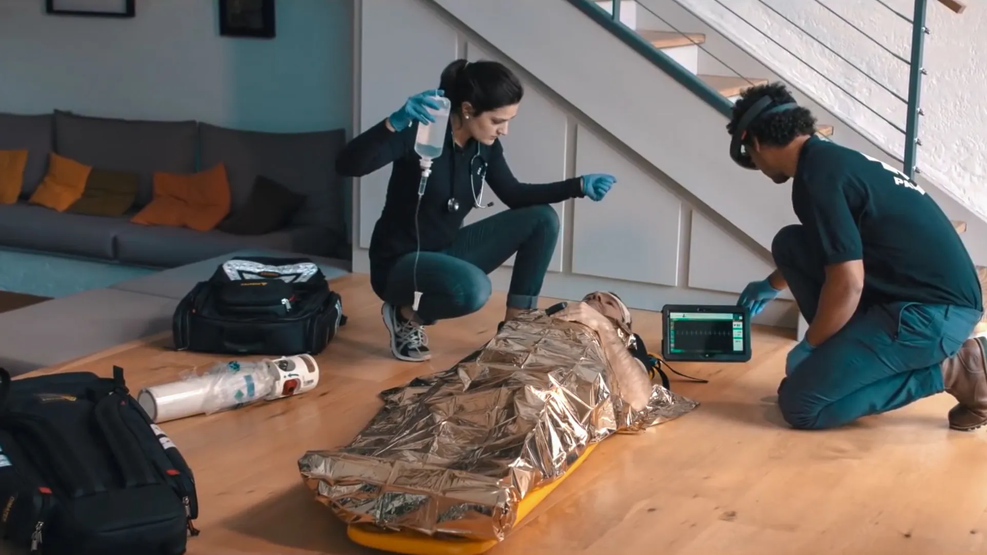 Medical team in emergency response with Nomadeec and HoloLens, using mixed reality for telemedicine and vital patient monitoring.