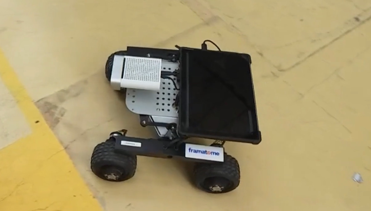 Operator using a HoloLens helmet to remotely control a Leo Rover robotic inspection tank equipped with a 3D camera, as part of the DRALLE project developed by HoloForge Interactive and Framatom.