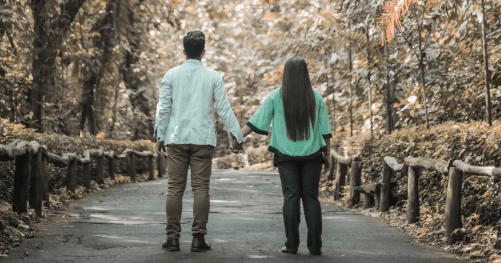 Married couple holding hands