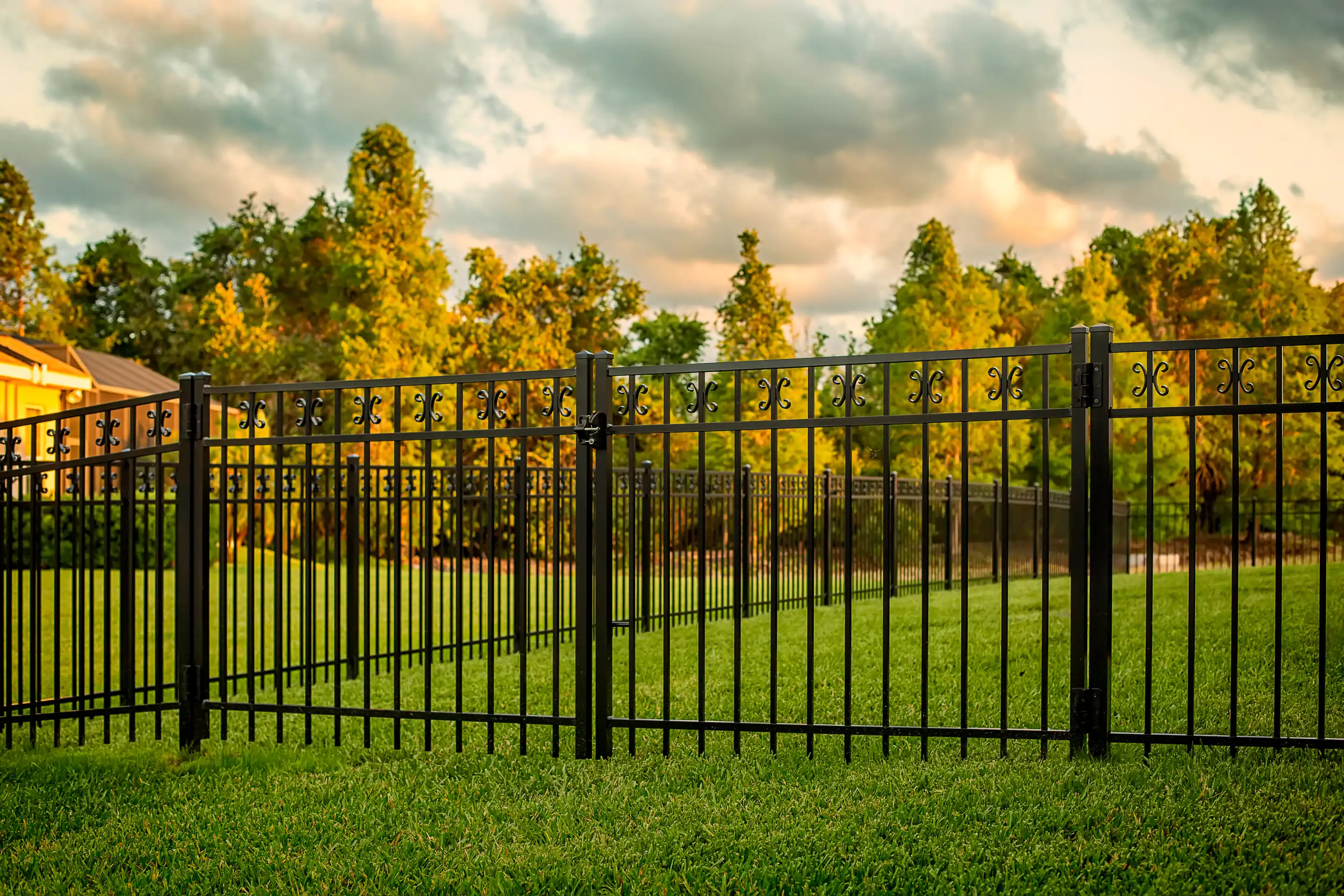 Professional black aluminum fence installation services by G. DeLuca and Sons