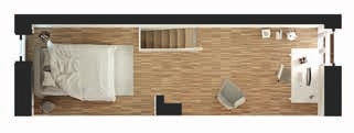 Grundriss der oberen Galerieebene des New-York-Apartments mit Bett, Schreibtisch und Lesesessel.