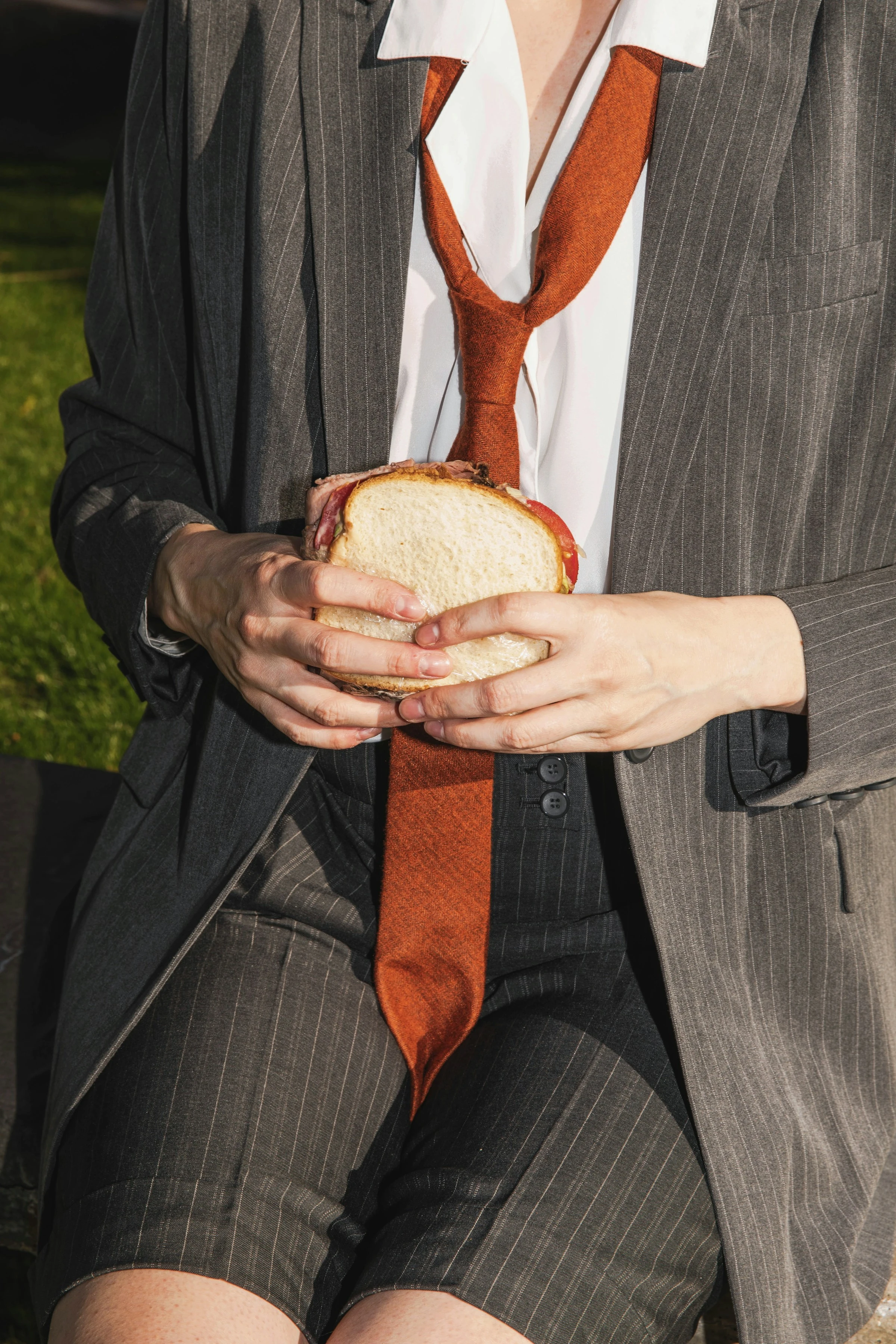 office worker eating a sandwich