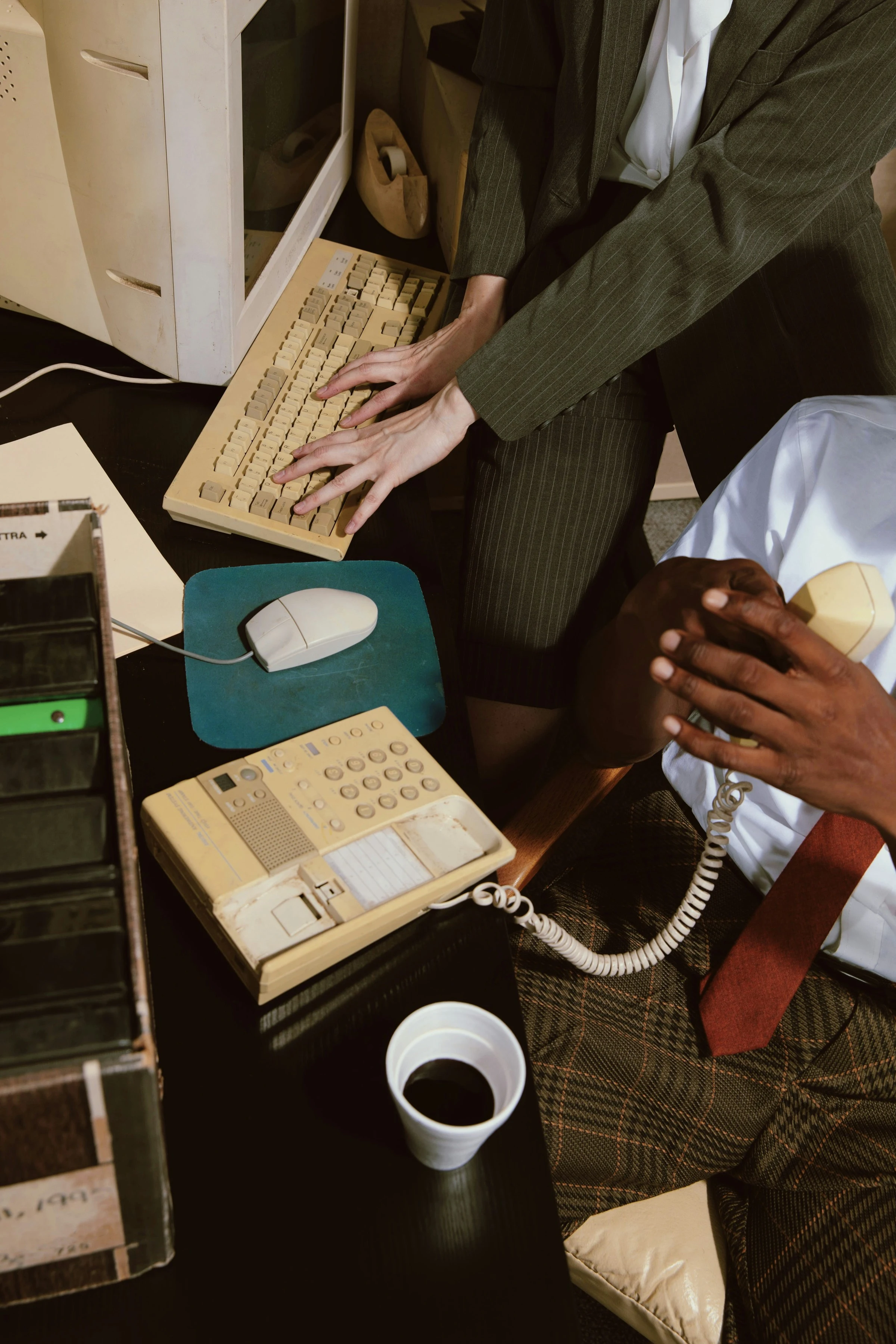 Office workers on phone and desktop computer