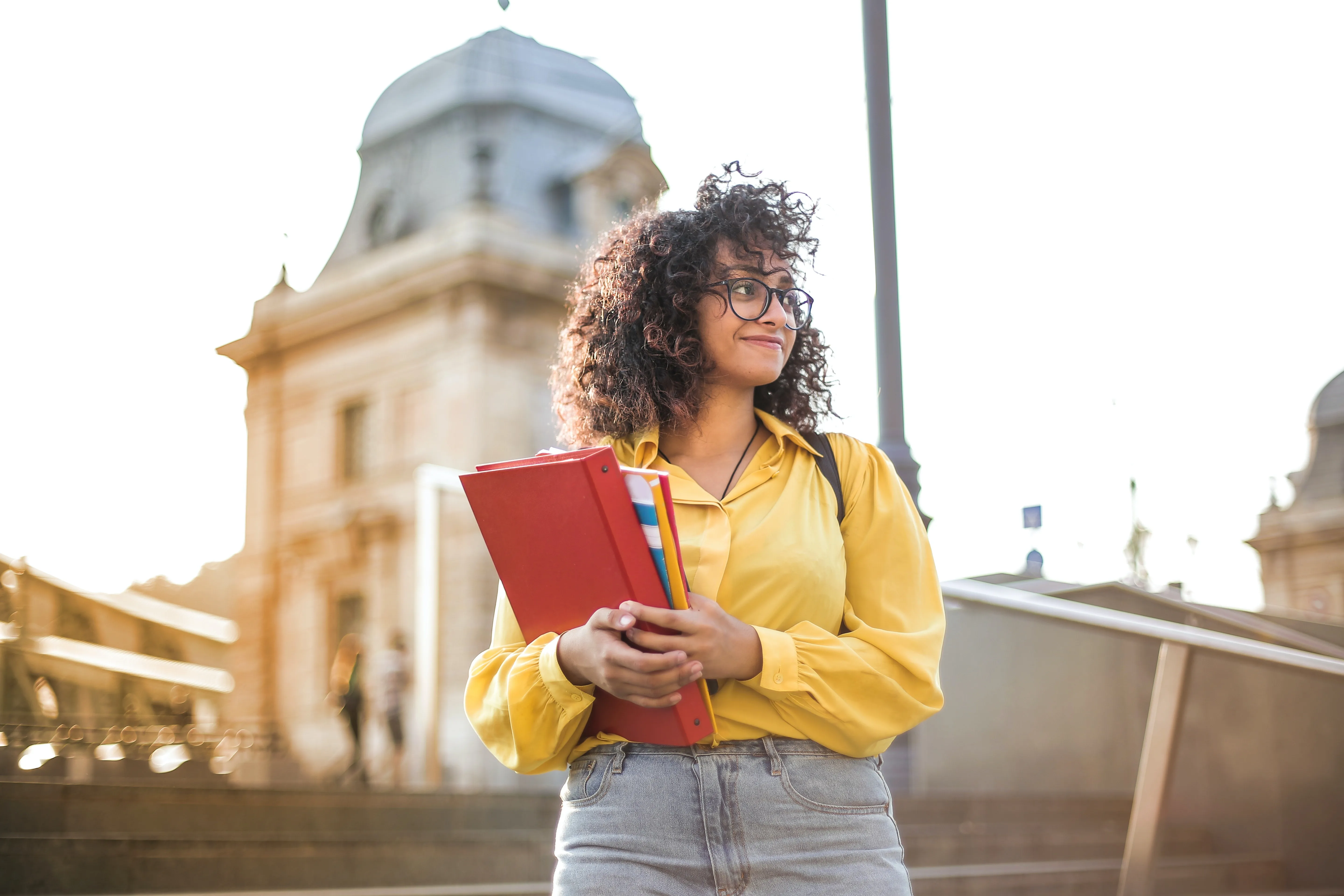 girl with book walking stock image