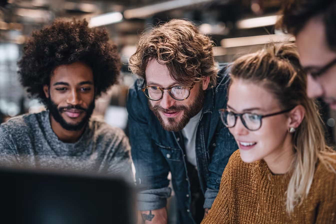 Diverse team analyzing IT automation solutions