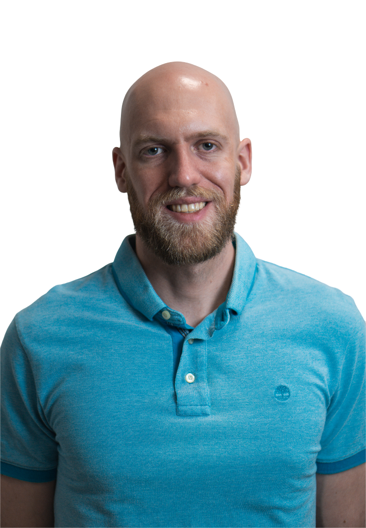 Smiling IT support professional in blue Timberland polo, representing Unified Technicians managed services team in Toronto