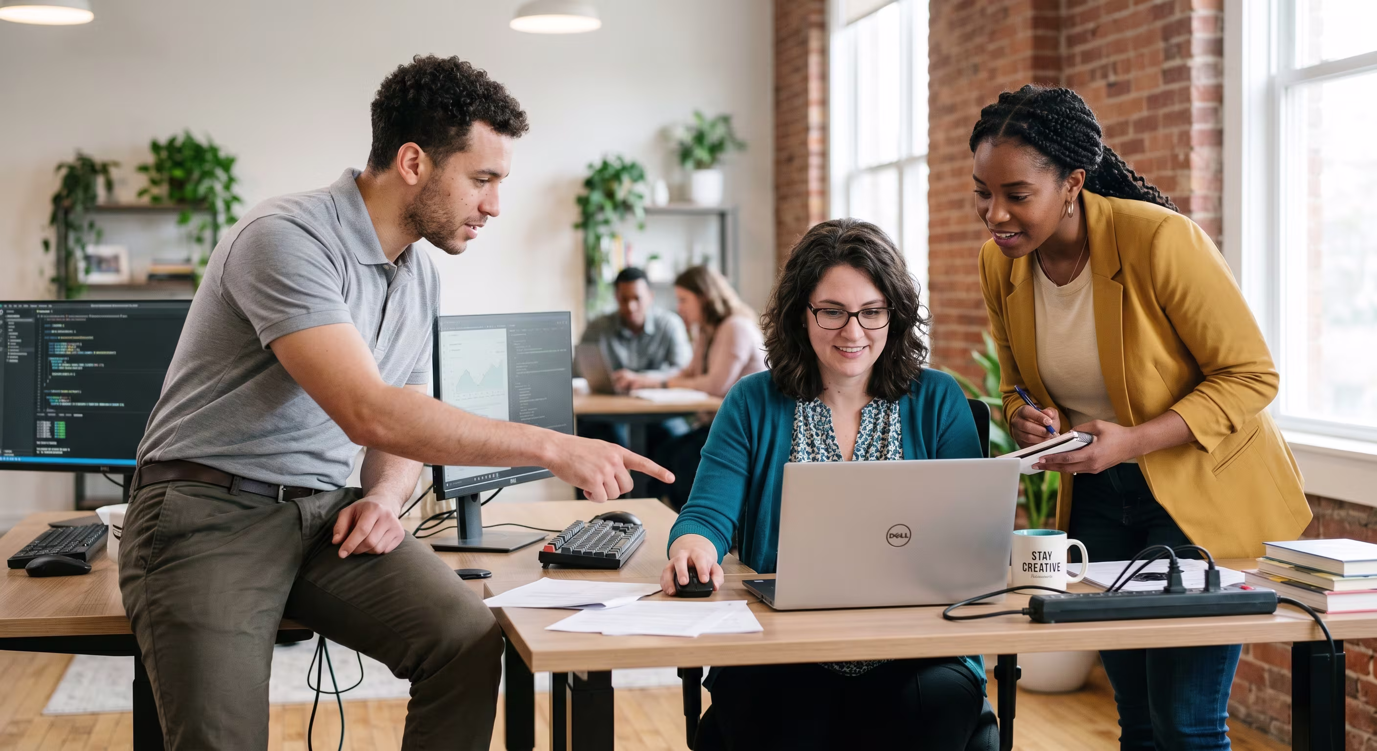 IT Technician Assisting Diverse Small Business Team