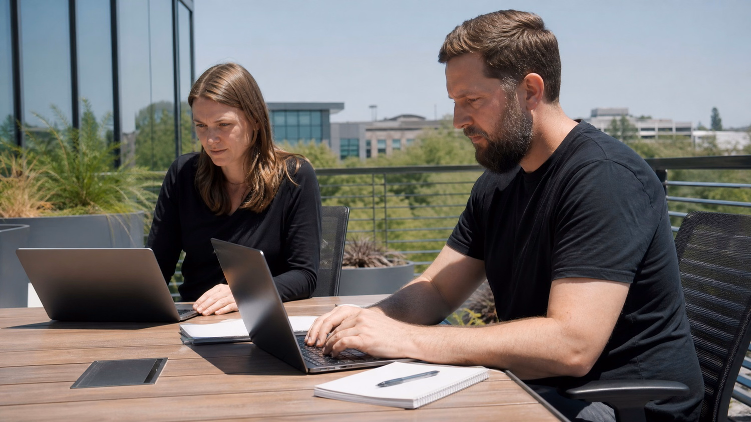 OUTDOOR TERRACE An IT professional  one or two people working at a table on a