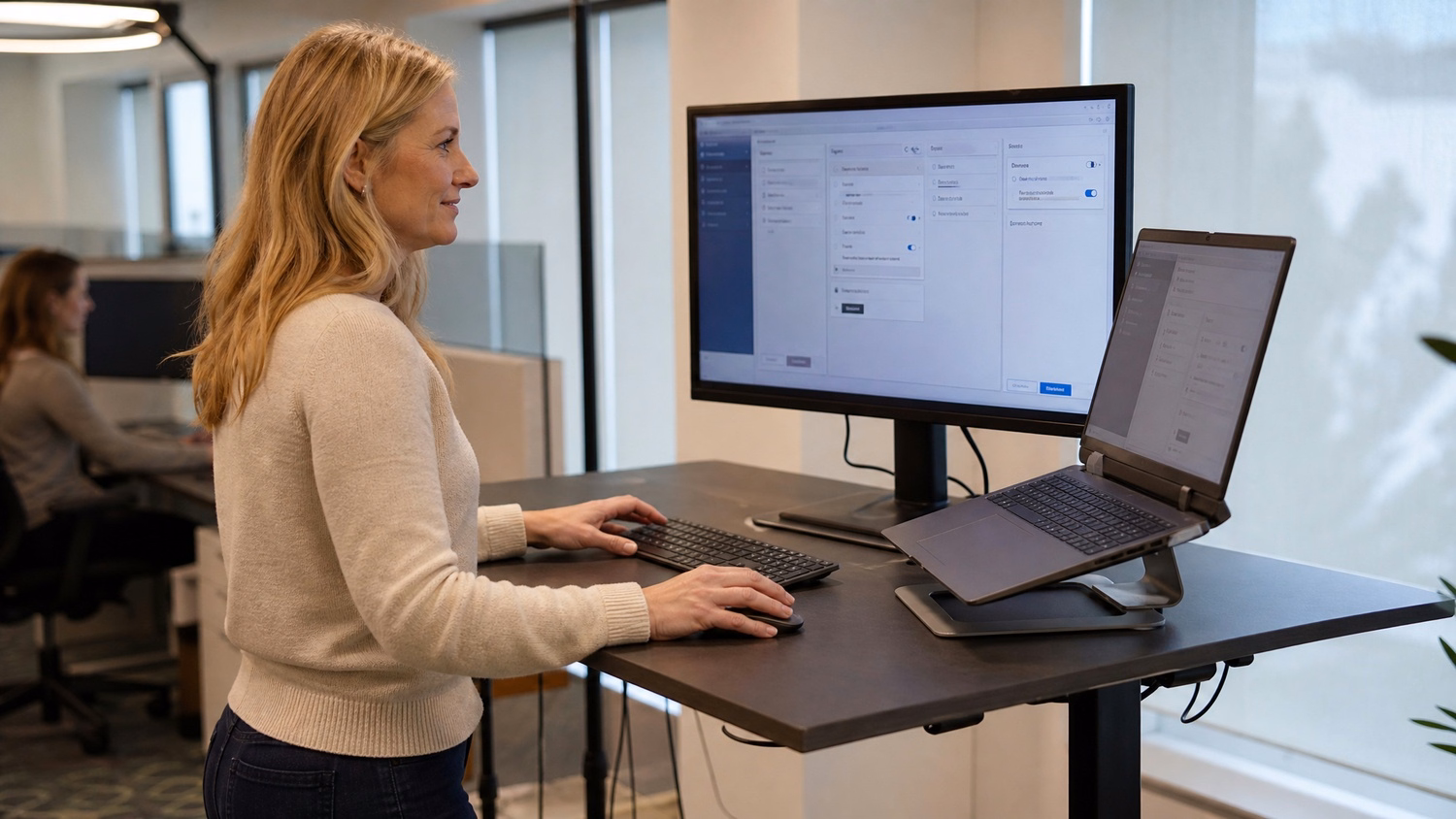 Woman configures VoIP call routing on standing desk dashboard 71