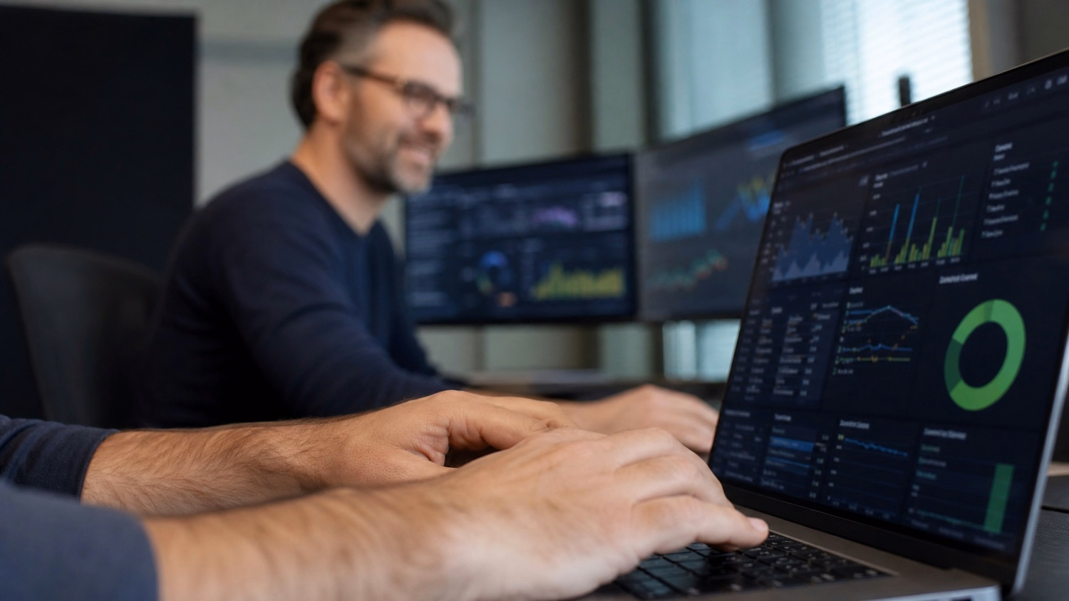 Mans hands typing on laptop, complex dashboard visible 65