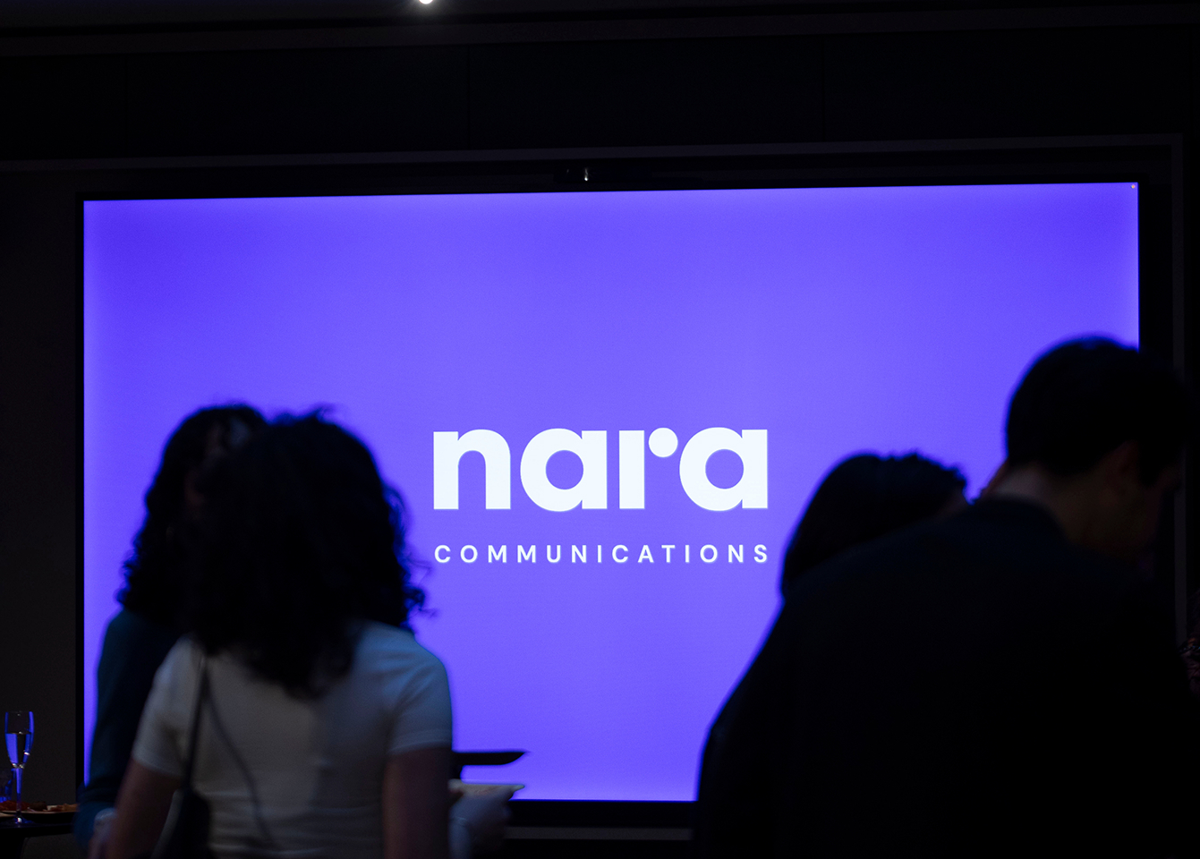 Nara team working with logo in background