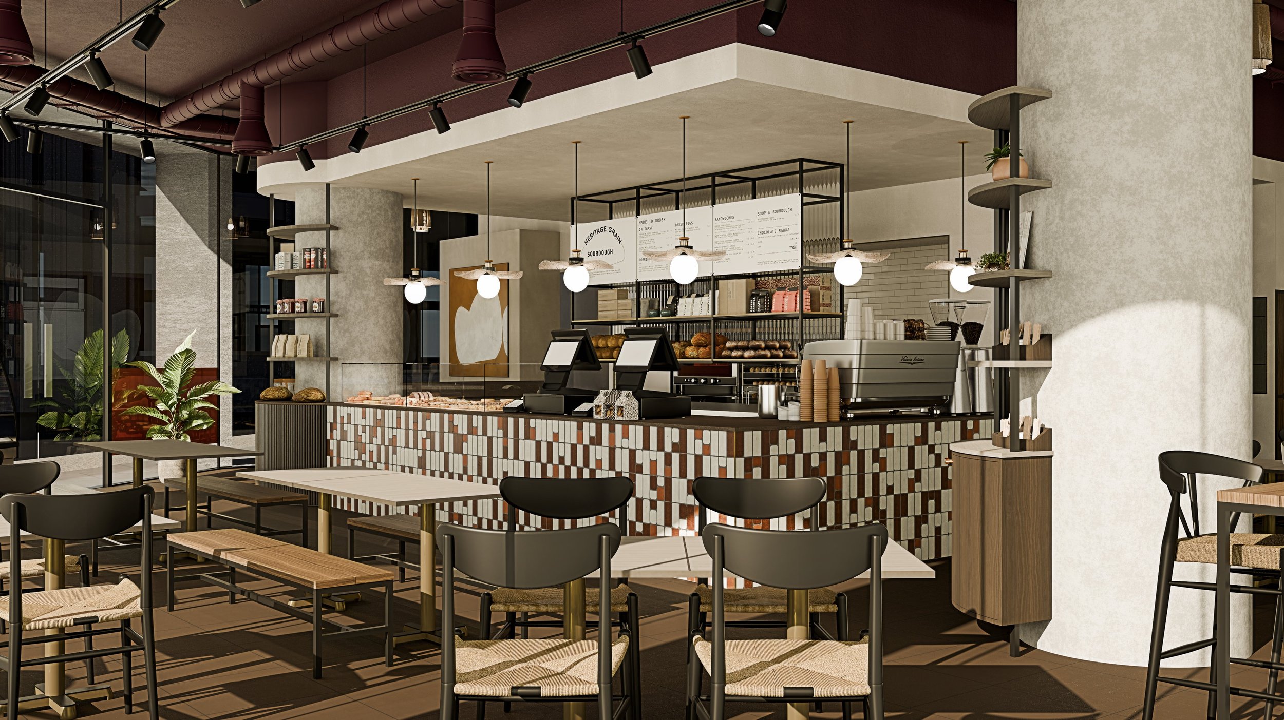 TXTURED commercial interior design for a modern Manchester café with bespoke tiled bar, pendant lighting, and warm earthy tones.
