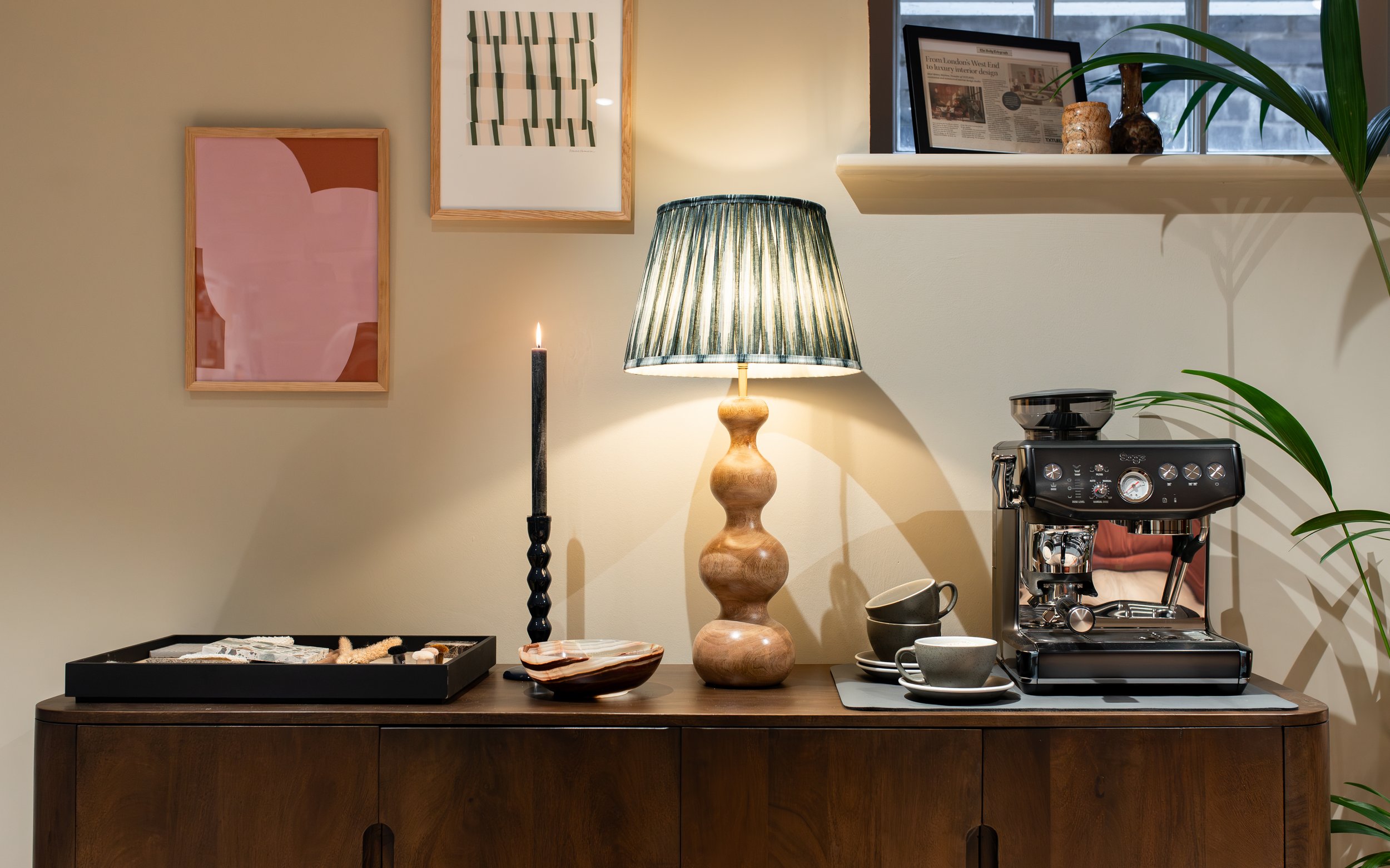 Styled coffee station with espresso machine, sculptural lamp, and modern decor by TXTURED in Manchester