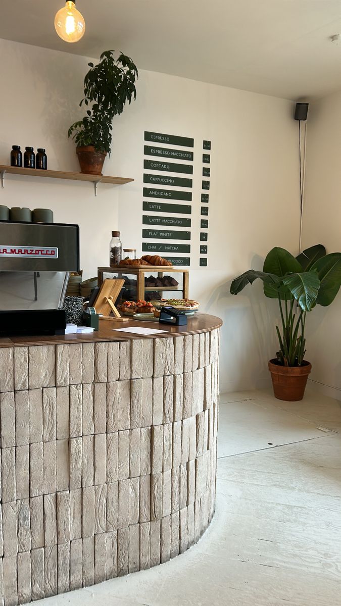 Restaurant bar design in Knutsford featuring fluted wood panelling and marble top