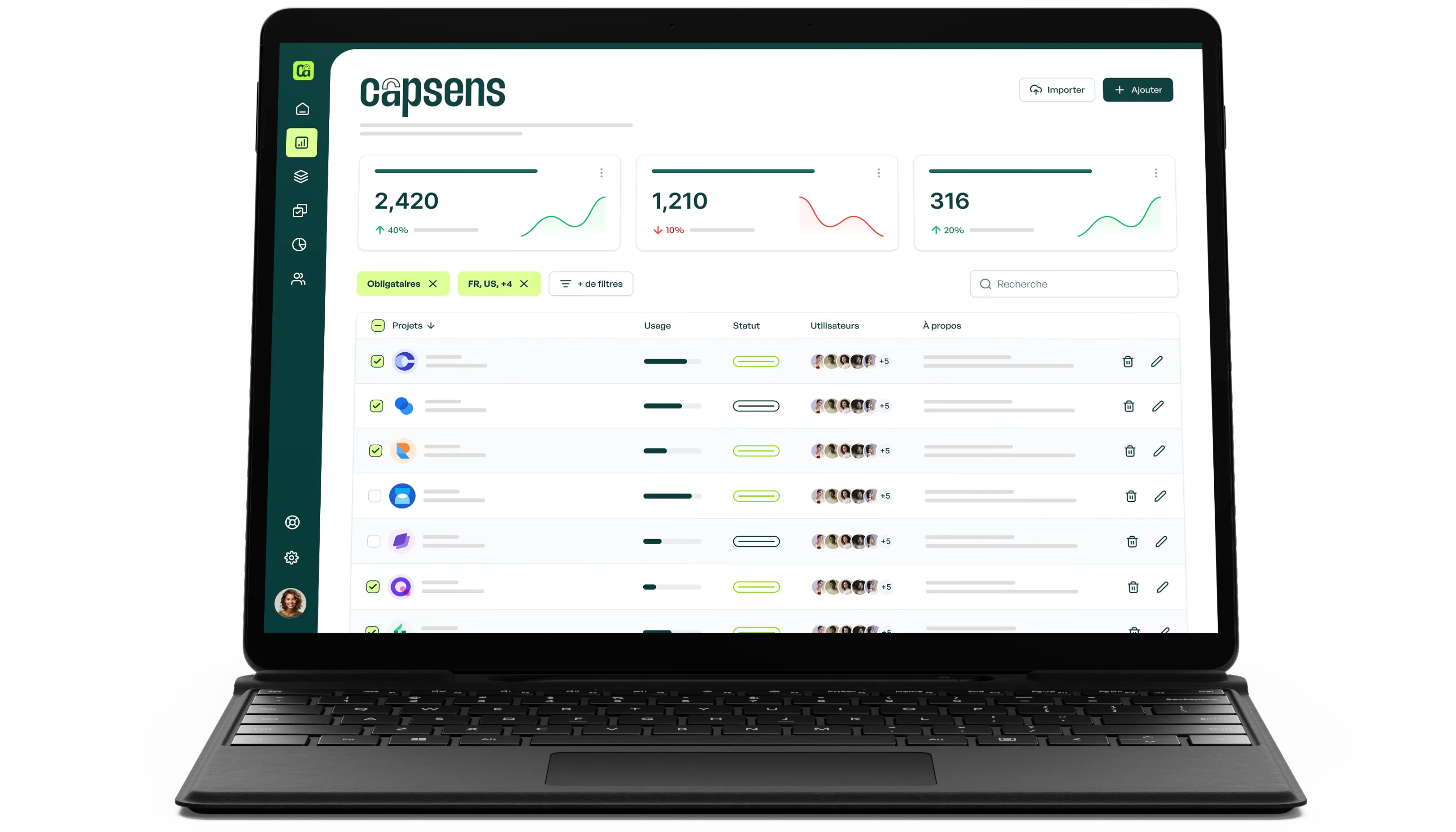 Black laptop displaying a Capsens login page with a login form and a photo of modern buildings in the background.