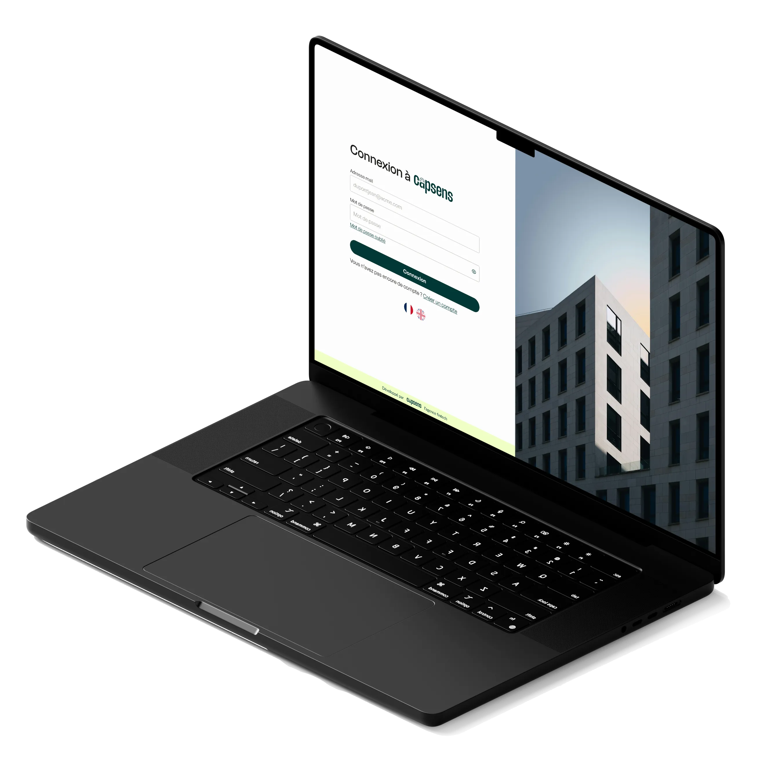 Ordinateur portable noir affichant un écran de connexion Capsens avec formulaire de connexion et photo de bâtiment moderne.