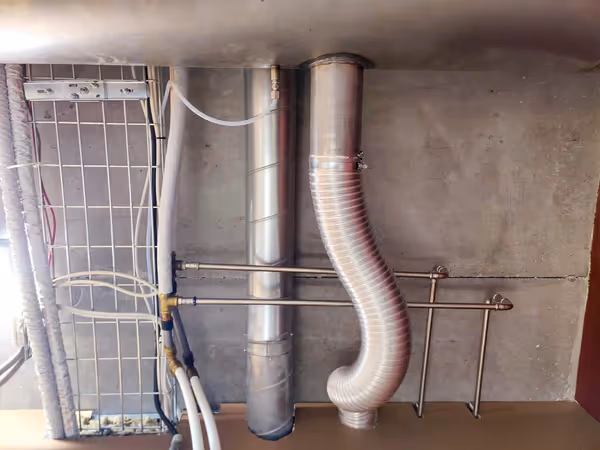 Picture of the exhaust line near the exhaust vent and nio