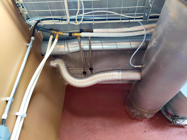 Picture of the connection between the ozone device and the exhaust pipe