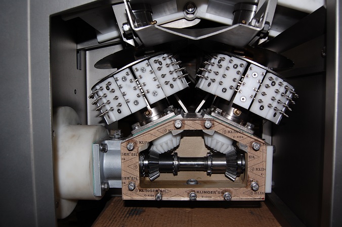 Internal rotating rollers of scalping machine for fish head flesh recovery.