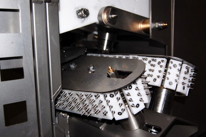 Angled view of scalping machine’s rotating cutting rollers.