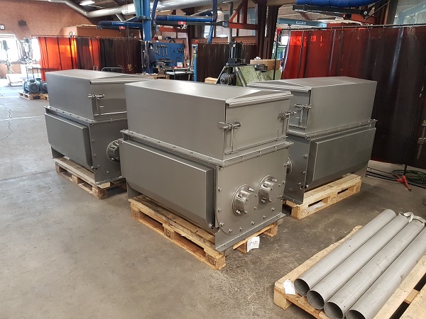 Three horizontal seafood mixers on pallets ready for installation.