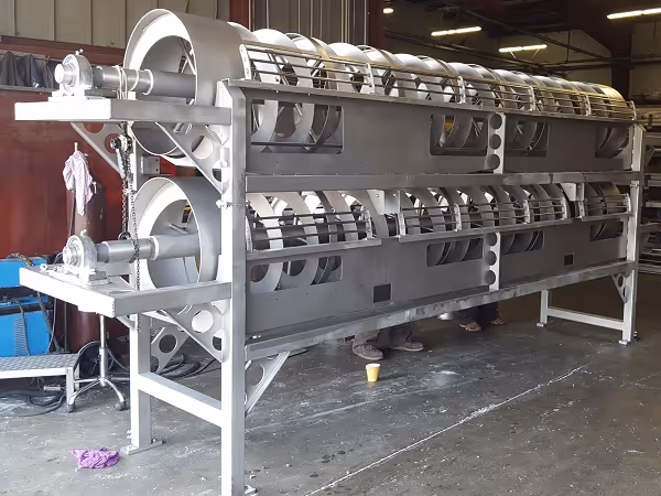 Large stainless steel rotary screening system for water filtration.