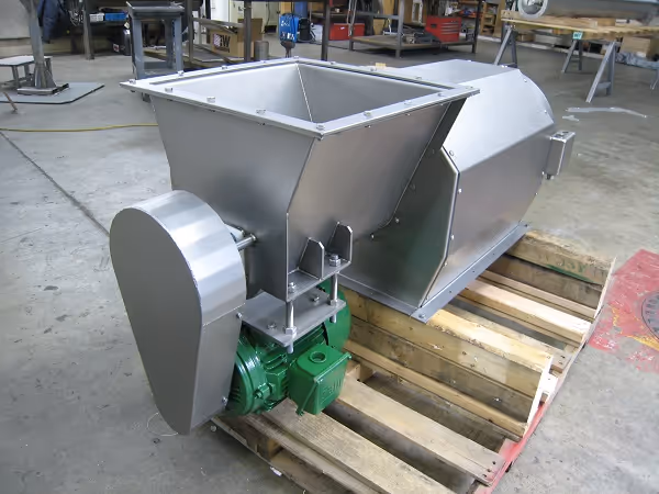 Industrial bone separator machine for removing bones from fish meal, stainless-steel build.