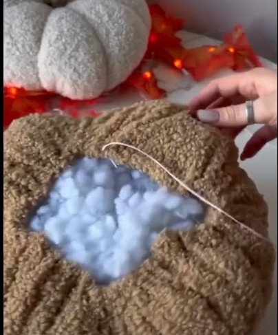 image of a tailor deep in thought while stitching