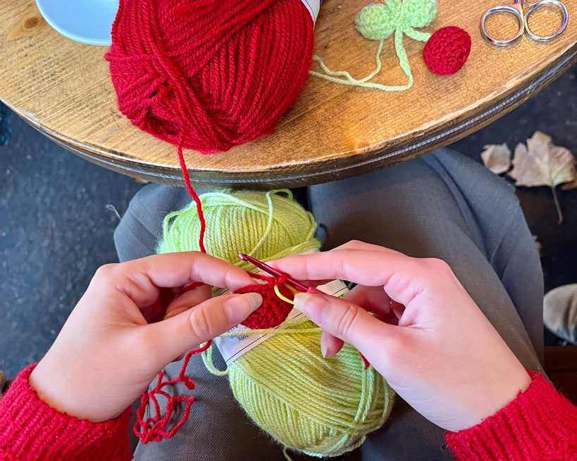 image of a tailor deep in thought while stitching