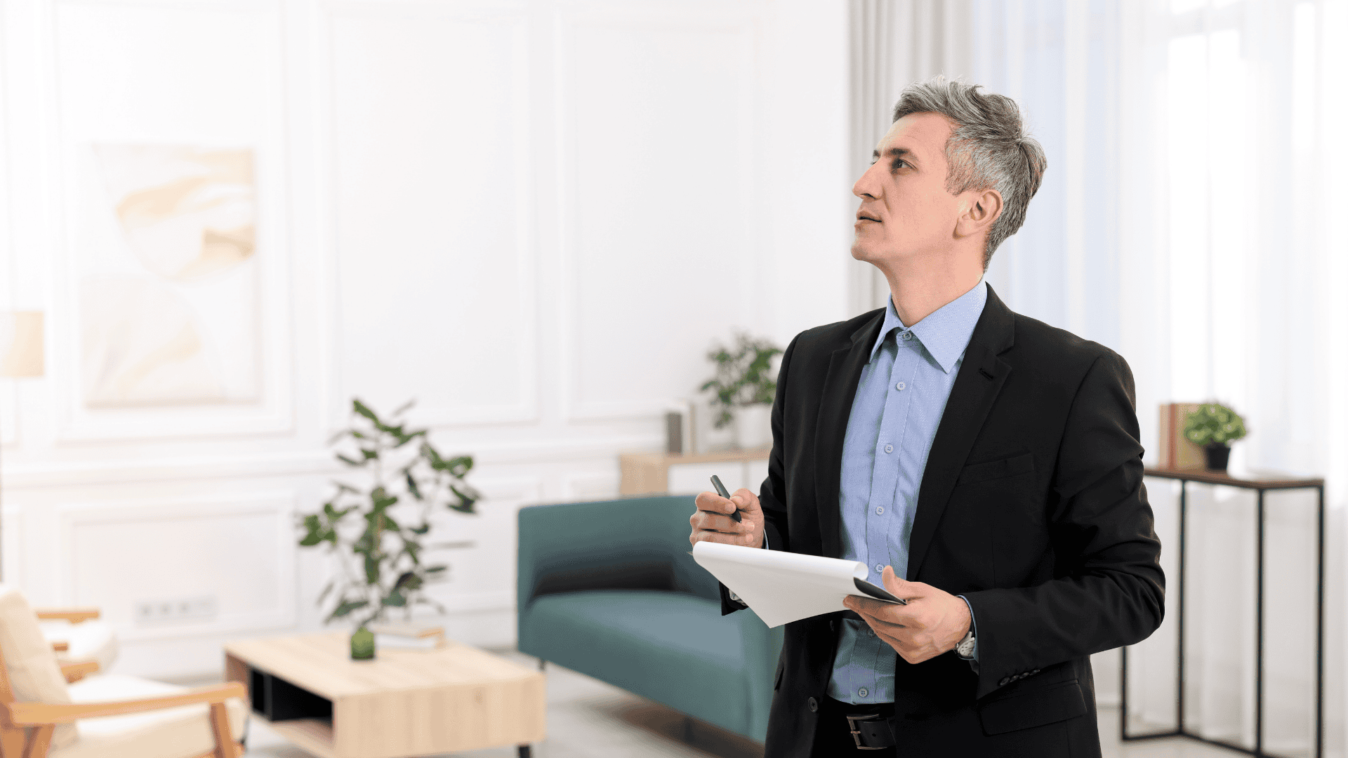 Home inspector checking a modern suburban house exterior with clipboard