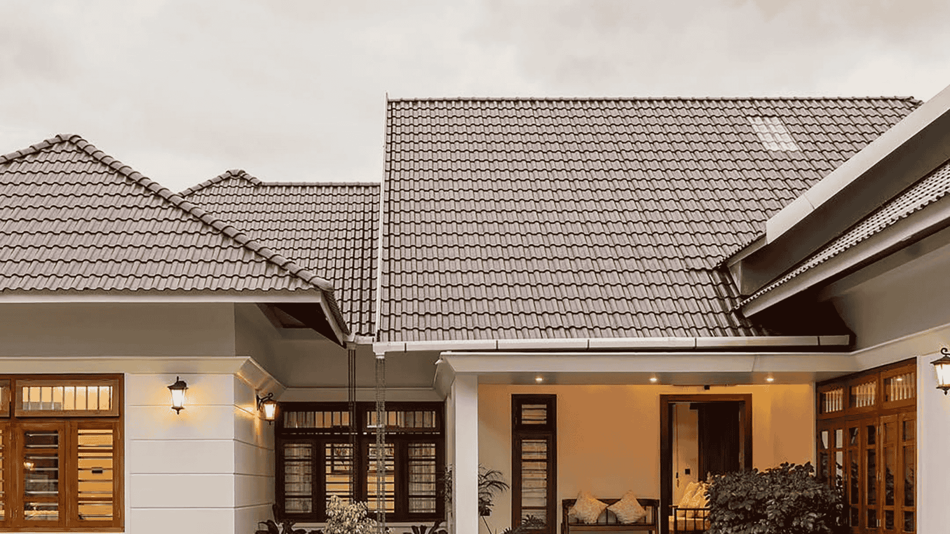 Springtime Manchester NH street with houses, greenery, and pedestrian enjoying the neighborhood.