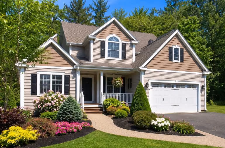 Clean Merrimack NH home exterior with fresh landscaping before a summer listing.