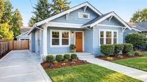 Well-maintained Methuen, MA home exterior with fresh landscaping and welcoming curb appeal for summer buyers.