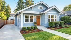 Well-maintained Methuen, MA home exterior with fresh landscaping and welcoming curb appeal for summer buyers.