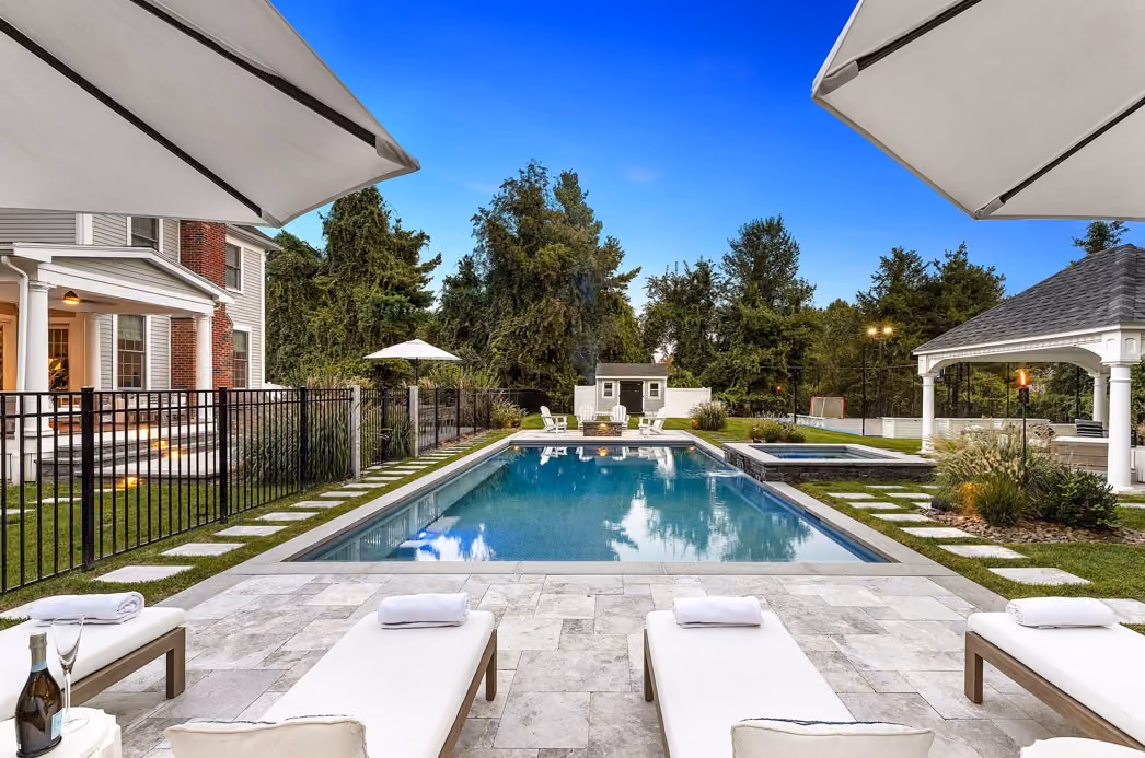 Well-maintained premium home exterior on a quiet Andover, Massachusetts residential street with mature landscaping.
