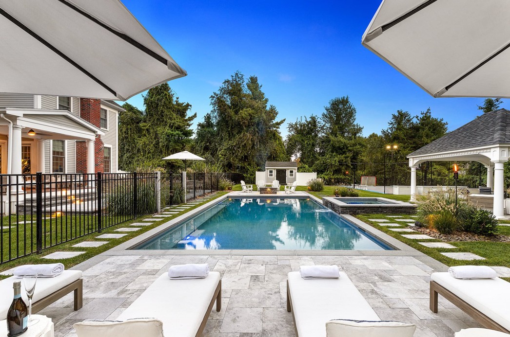 Well-maintained premium home exterior on a quiet Andover, Massachusetts residential street with mature landscaping.