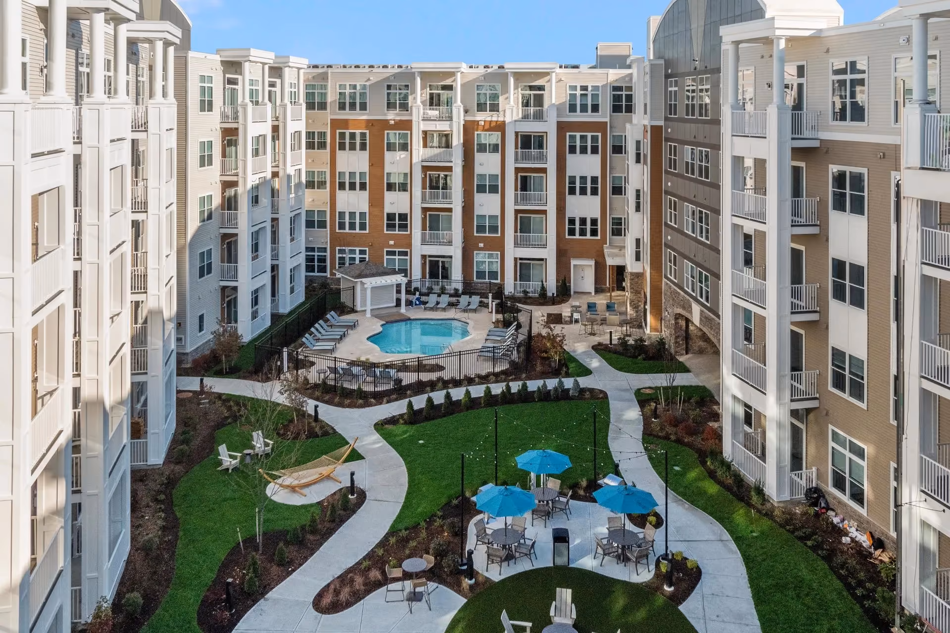 A bright summer view of Salem, NH near Tuscan Village, Route 28, or a clean residential neighborhood setting that reflects Salem’s cross-border lifestyle, local convenience, and Southern New Hampshire appeal.