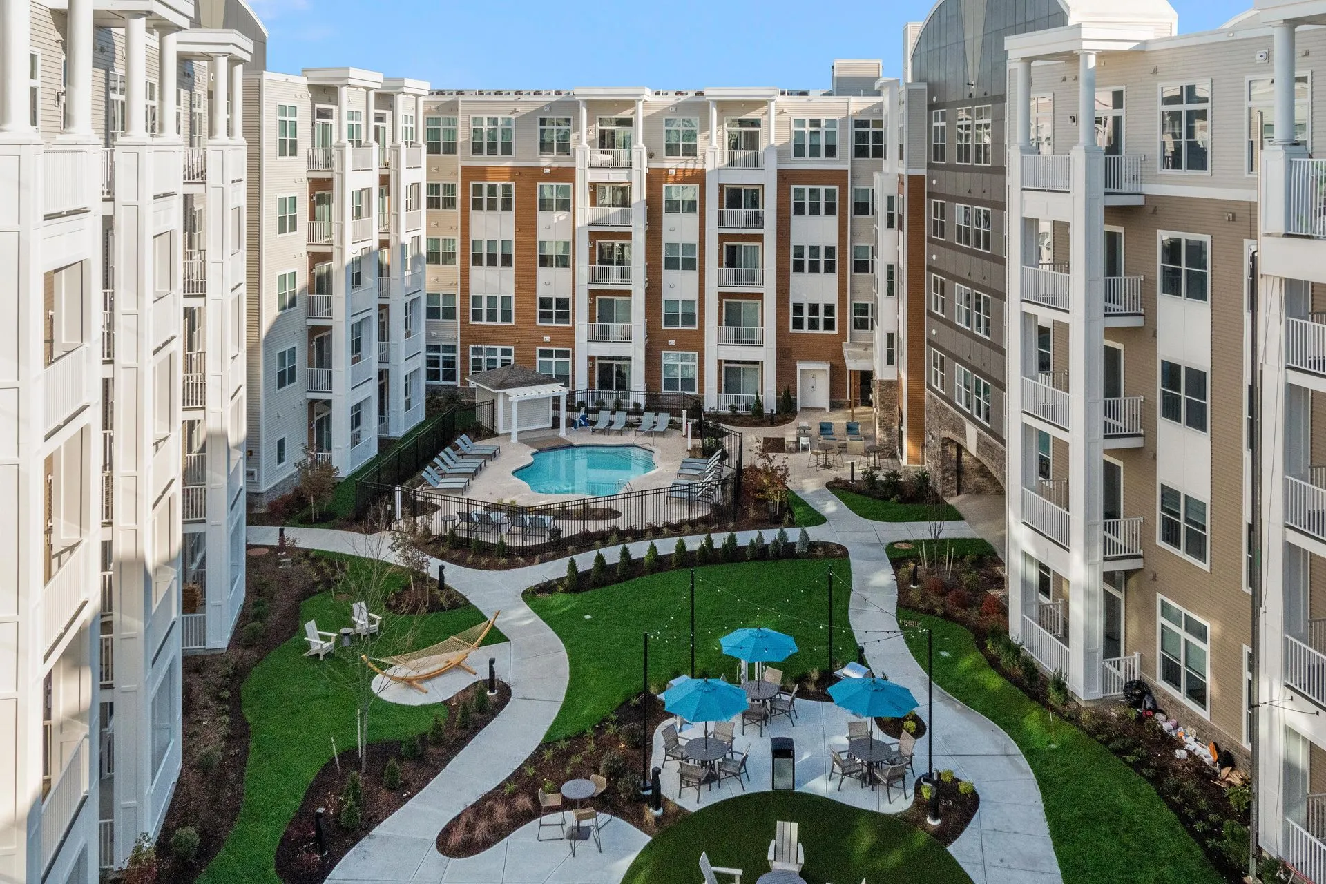 A bright summer view of Salem, NH near Tuscan Village, Route 28, or a clean residential neighborhood setting that reflects Salem’s cross-border lifestyle, local convenience, and Southern New Hampshire appeal.
