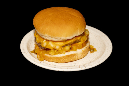 A bowl of onion rings with ketchup.