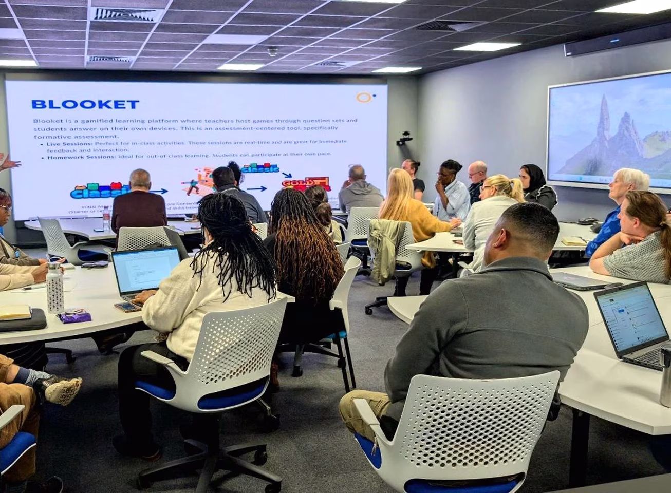 A trainer presenting to a room full of learners using immersive technologies, including the Classview platform