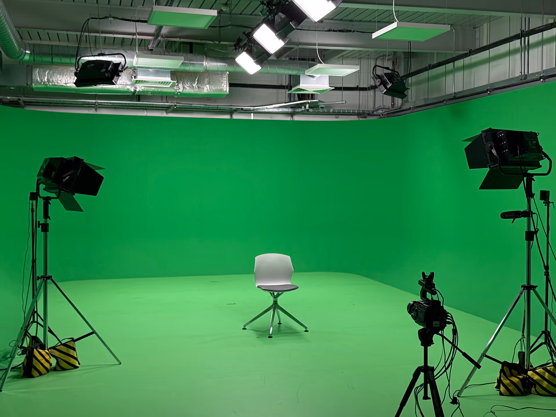 A dynamic image showing the Content Capture Studio setup with screens displaying real-time Unreal Engine capture.